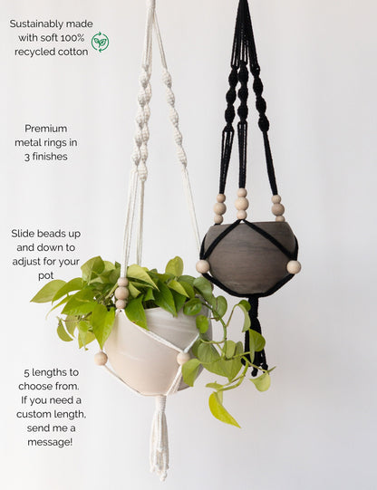 Two plant hangers with a spiral design at the top and beads at the bottom